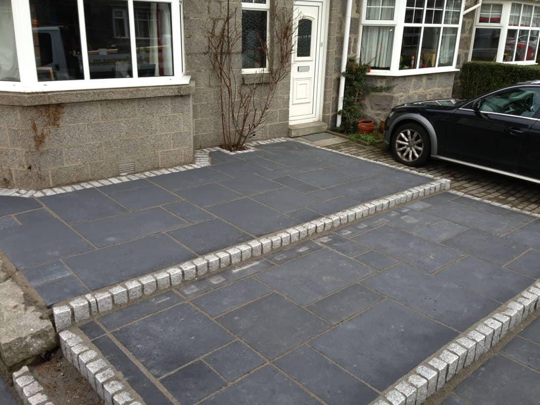 Dark tiles infront of a house